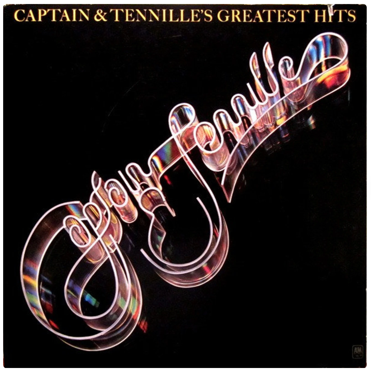 Album cover with black background and "Captain & Tennille" in 3D acrylic letters.